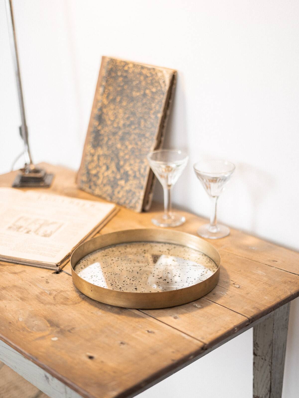 Patinated mirrored top and brass