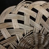 Large vintage twisted wicker basket on a stand