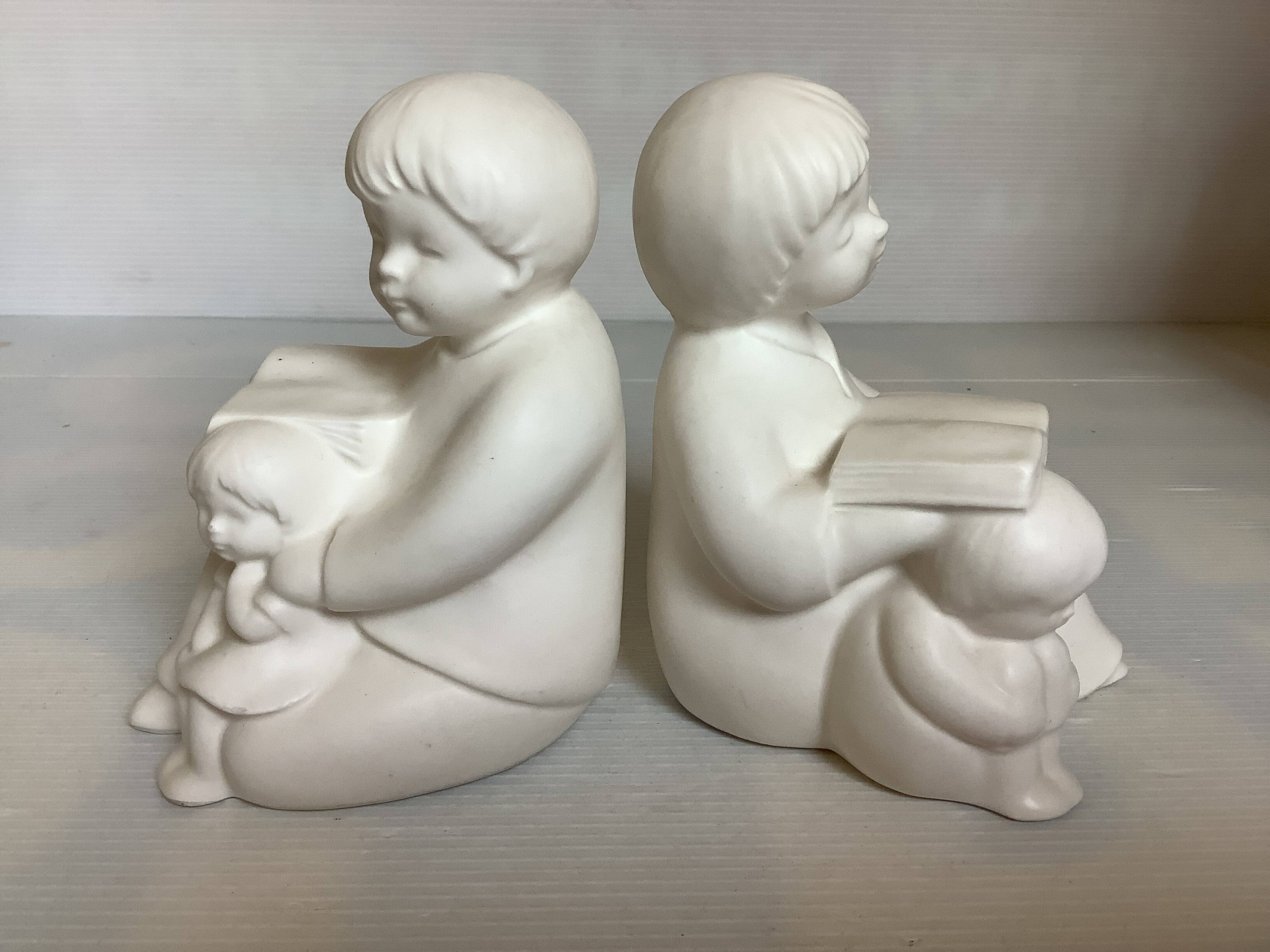 Pair of bookends with a matte white glaze for children.