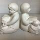 Pair of bookends with a matte white glaze for children.