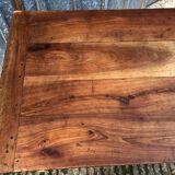Antique farmhouse table in solid cherry wood with turned legs.