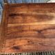Antique farmhouse table in solid cherry wood with turned legs.