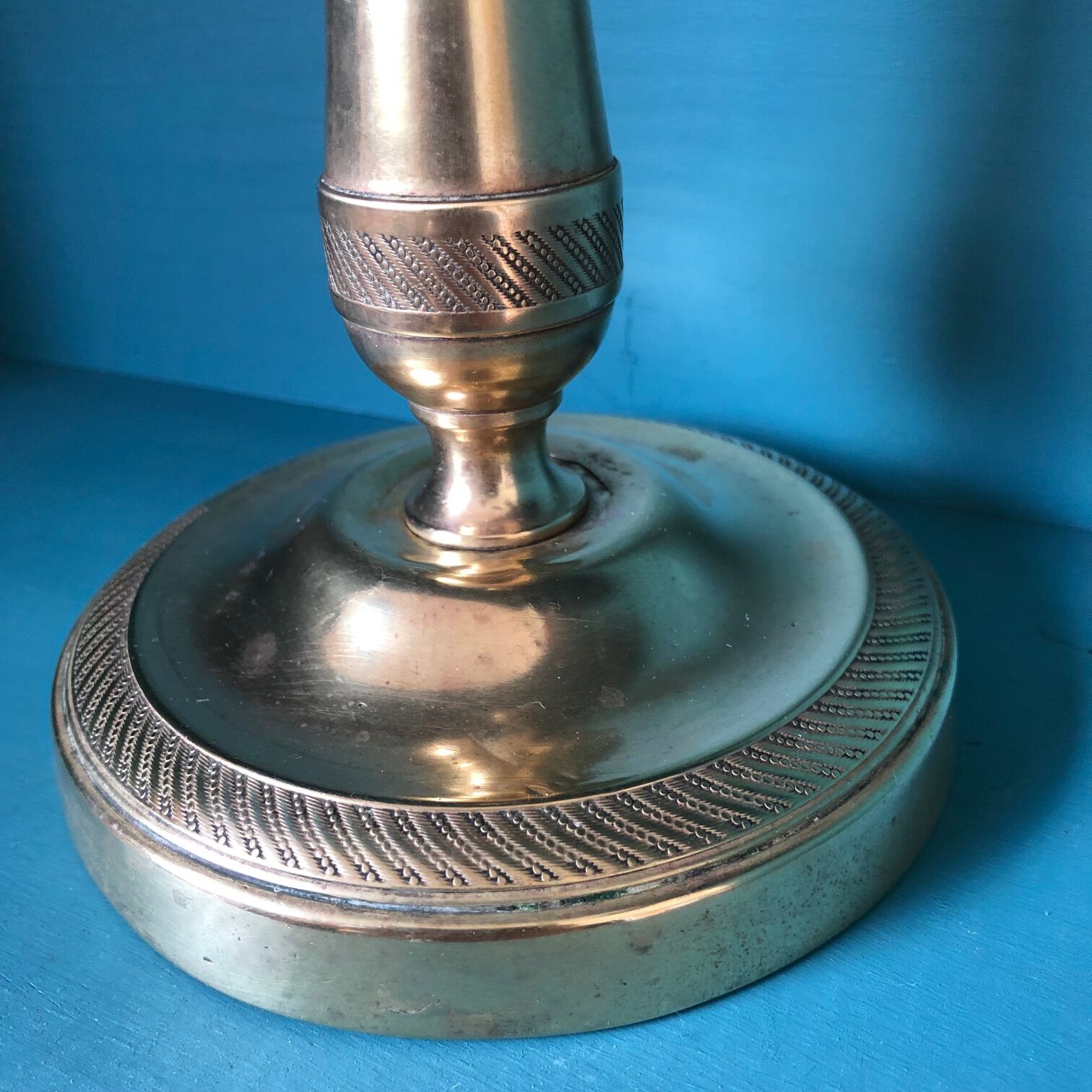 Large candlestick in chiseled brass