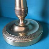 Large candlestick in chiseled brass