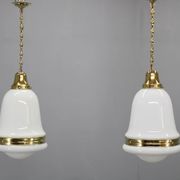 Pair of 1930s Peter Behrens Luzette pendants in opaline glass and brass