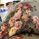 Set of two toad-shaped sofas covered in floral fabric.