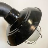 Industrial black enamel and cast iron wall lamp with iron grid, 1960s
