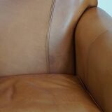 Cognac-colored cowhide leather armchair