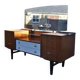 Mid-century hairdresser in brown teak and white with a mirror and brass legs.