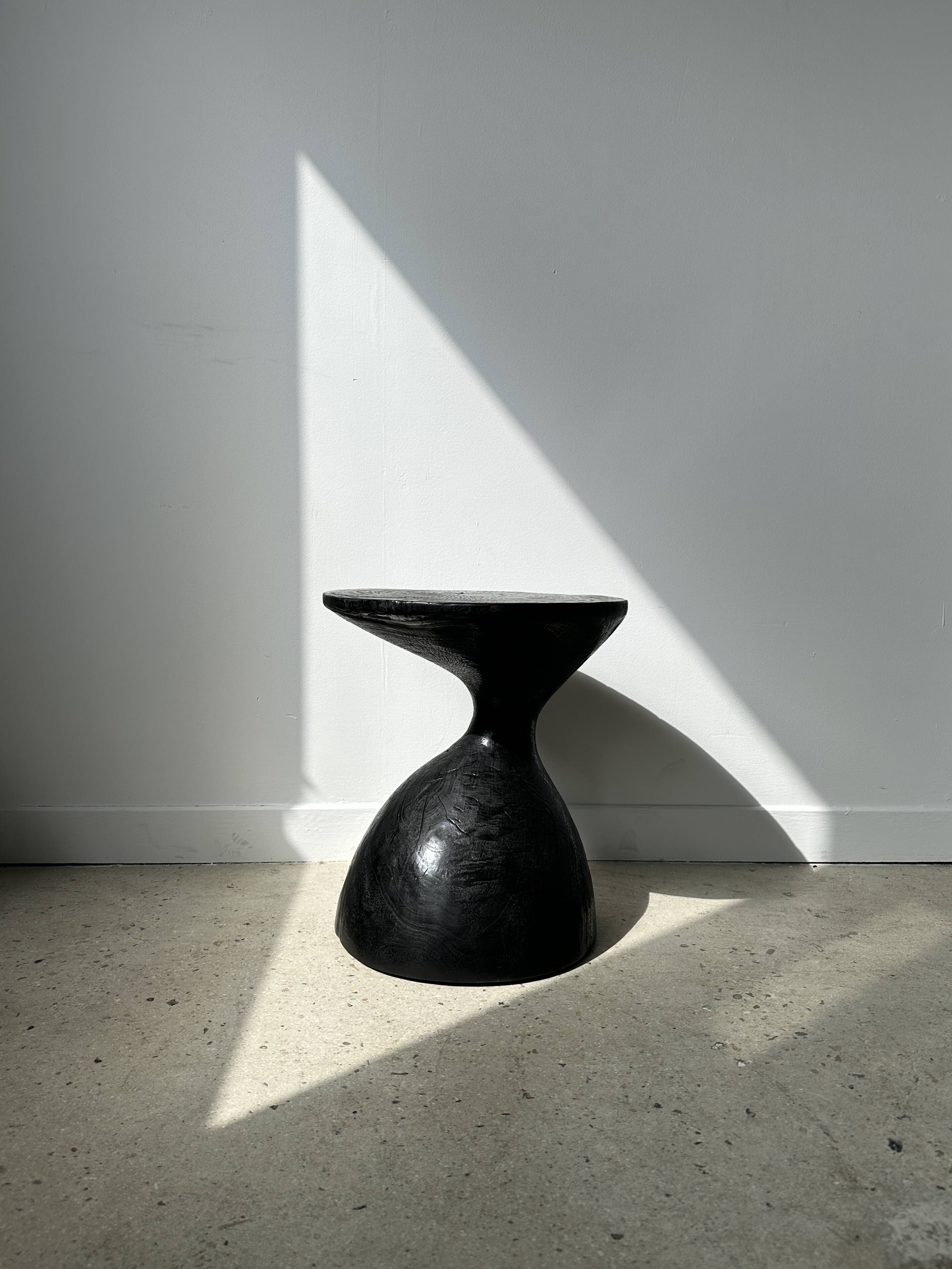 Solid wood (monoxyl) side table, organic shape, black color