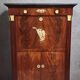 Rare four-column secretary from the Empire period in flame mahogany and bronze.