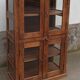 Old wooden display cabinet with three glazed sides