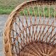 Old throne basket armchair in woven wicker