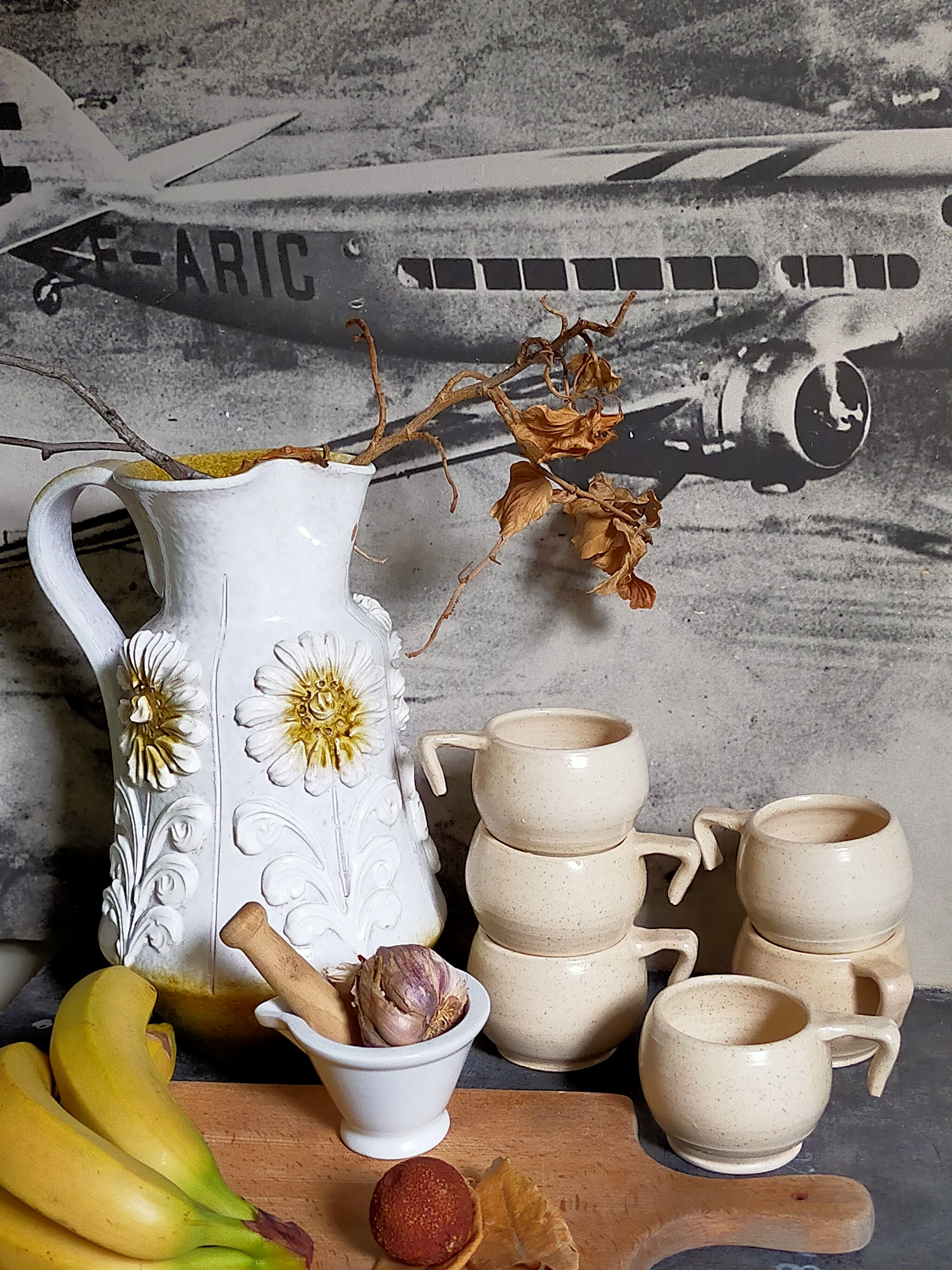 Six vintage potter's ceramic cups with vanilla enamel