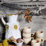 Six vintage potter's ceramic cups with vanilla enamel