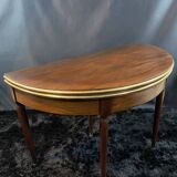 A Louis XVI period mahogany half-moon table forming a console/games table