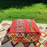 Handwoven floor pouf in natural wool