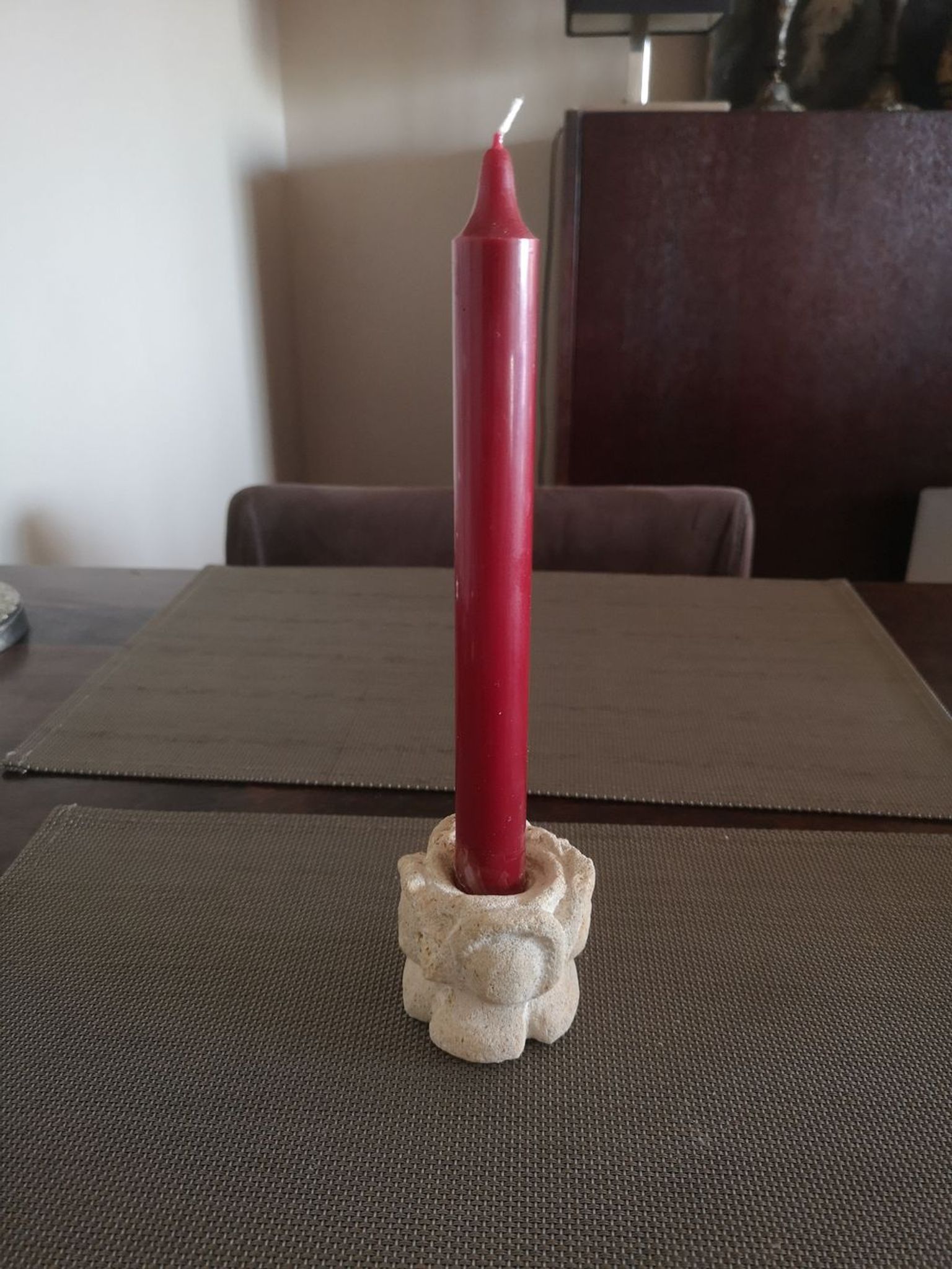 Candlestick in carved stone, signed