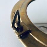 Porthole mirror in gilded brass