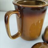 Coffee pot and sugar bowl in glazed stoneware, deep brown glazes.