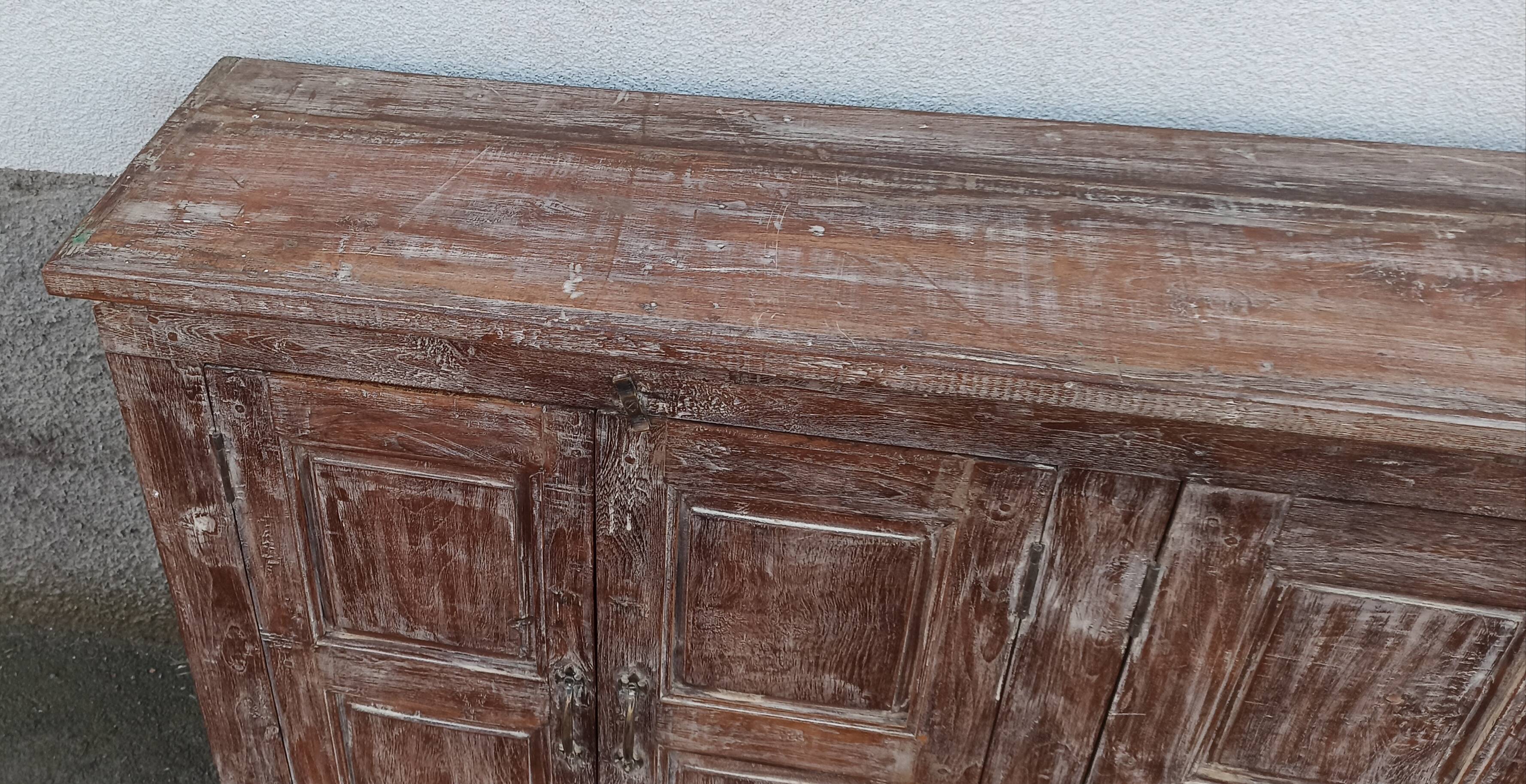 Old wooden sideboard with 4 doors