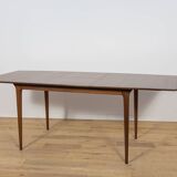 Extendable teak dining table in Mid-Century style from McIntosh, UK.