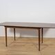 Extendable teak dining table in Mid-Century style from McIntosh, UK.