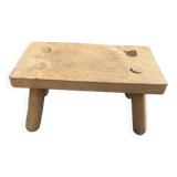 Small bench, footrest in artisanal raw wood
