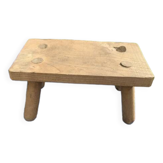 Small bench, footrest in artisanal raw wood