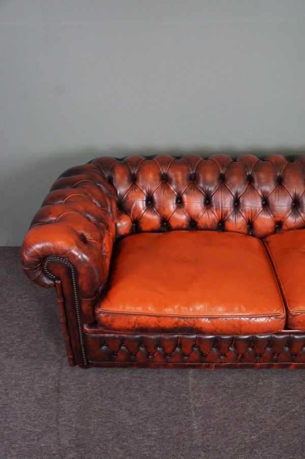 Chesterfield sofa in patinated orange leather, 2.5 seats