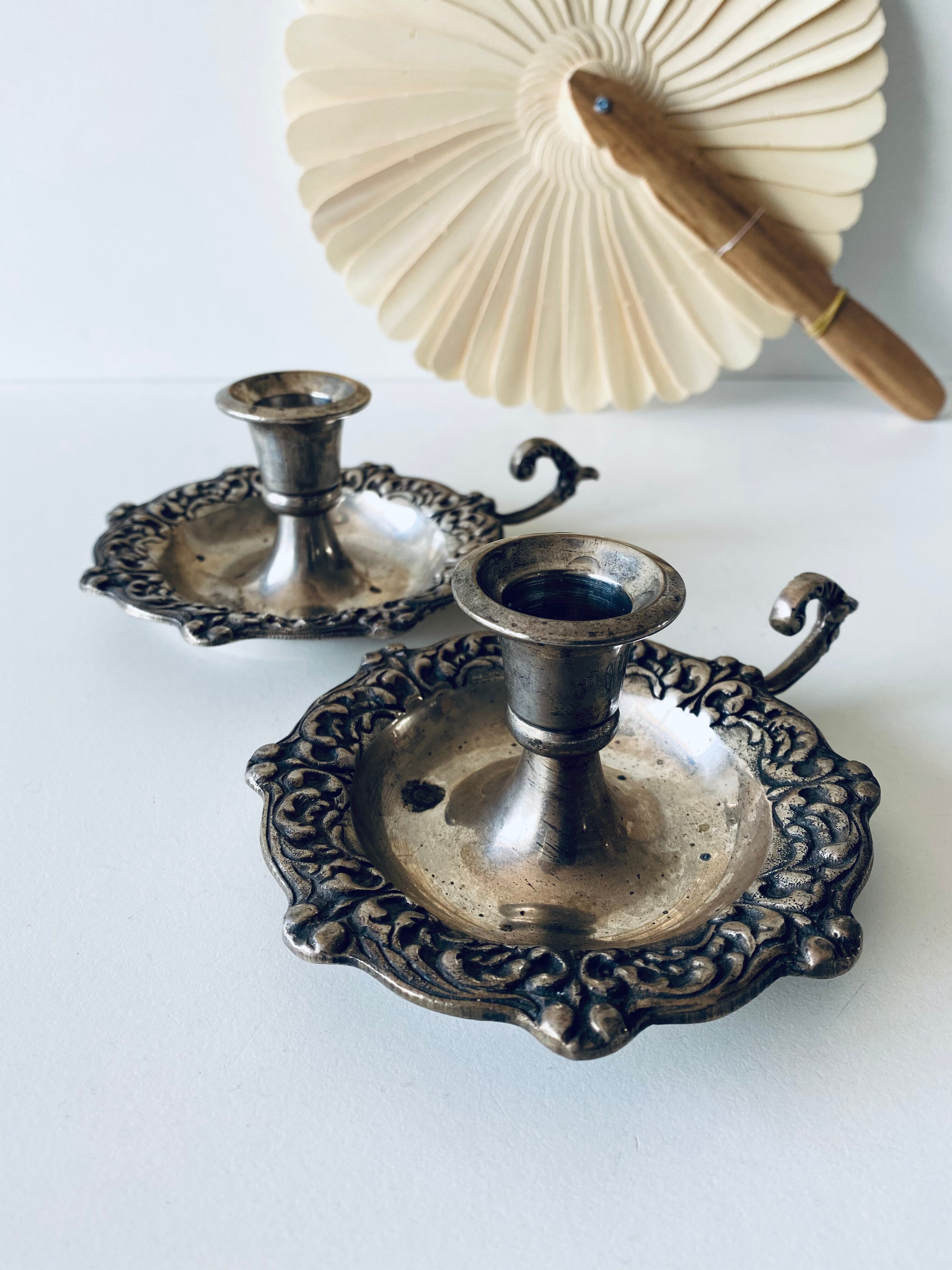 Pair of silver metal candlesticks
