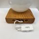 Modernist wall lamp in pine and opaline