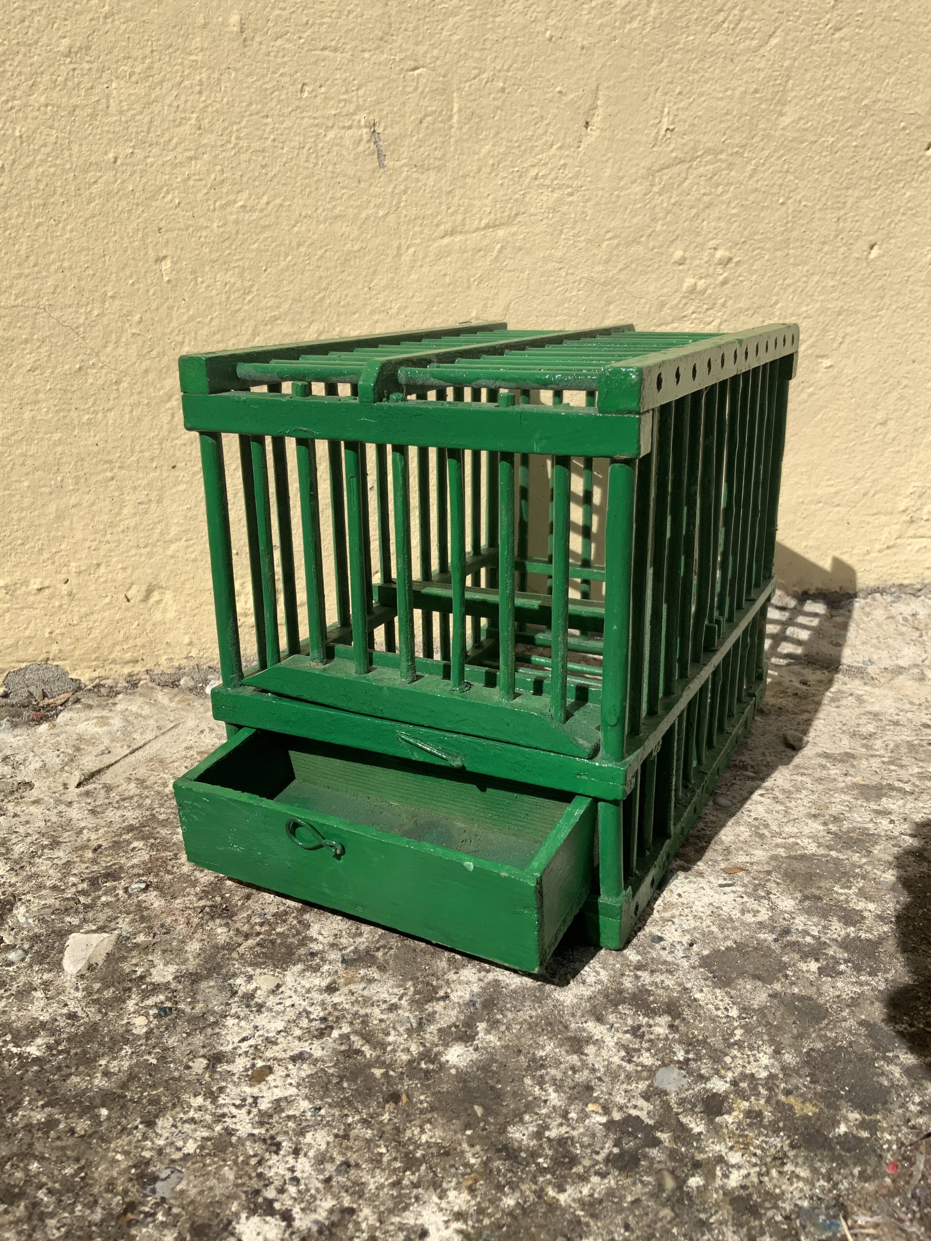 Old bird cage in green wood vintage decoration