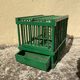 Old bird cage in green wood vintage decoration