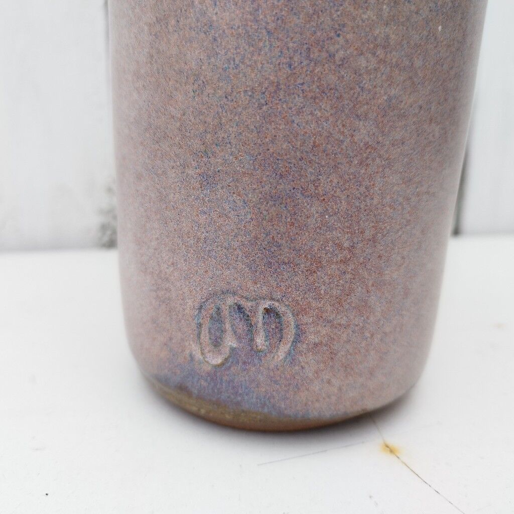Enamelled ceramic roller vase signed
