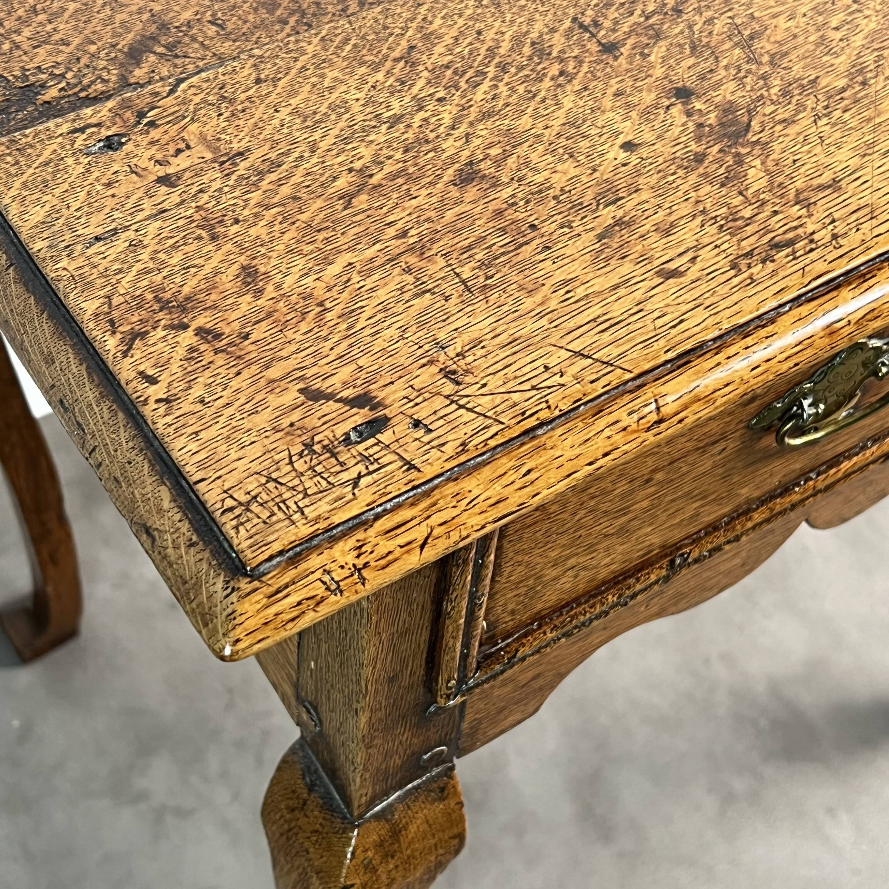Queen Anne Low-Boy side table in oak, England, 18th century.