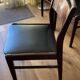 4 chaises à repas en palissandre et simili cuir marron - 1960