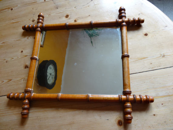 Mirror to the wooden frame imitating bamboo