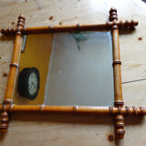 Mirror to the wooden frame imitating bamboo