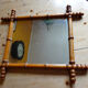 Mirror to the wooden frame imitating bamboo