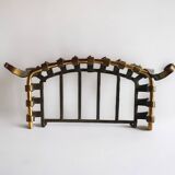Old cast iron and brass log holder