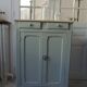 Small vintage Parisian sideboard with 2 doors and 2 drawers, enhanced in verdigris
