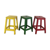 Three wooden stools with a handle