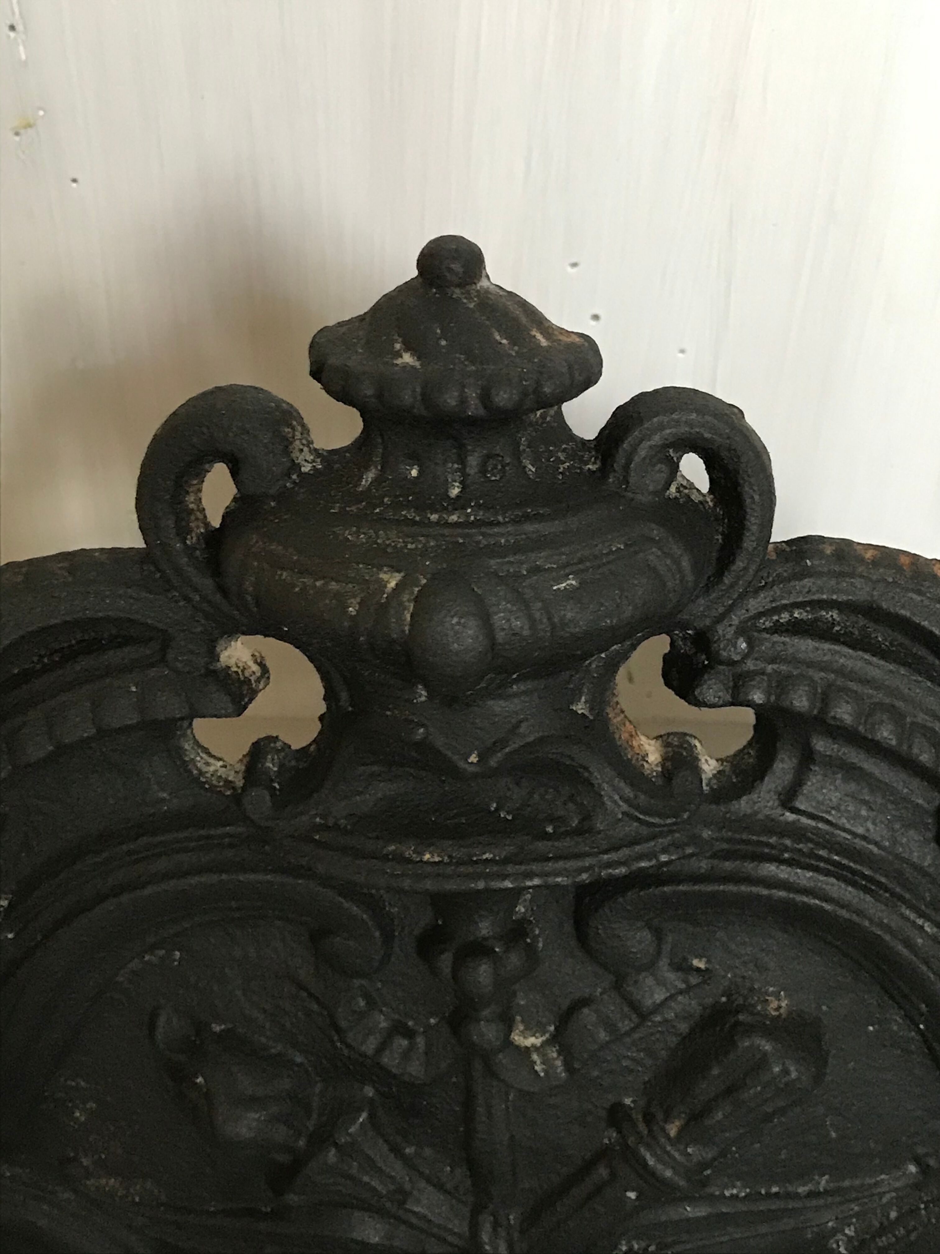 Cast iron fireplace cradle log holder