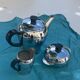Coffee service consisting of three pieces in chrome and bakelite vintage