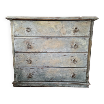 Beige and blue patinated chest of drawers in wabi-sabi style.