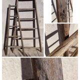 Two weathered wooden ladders H.135 cm