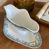 Ancienne saucière réparée avec la technique japonaise du kintsugi
