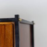Pair of mahogany veneer and black lacquered iron cabinets. 1950s.