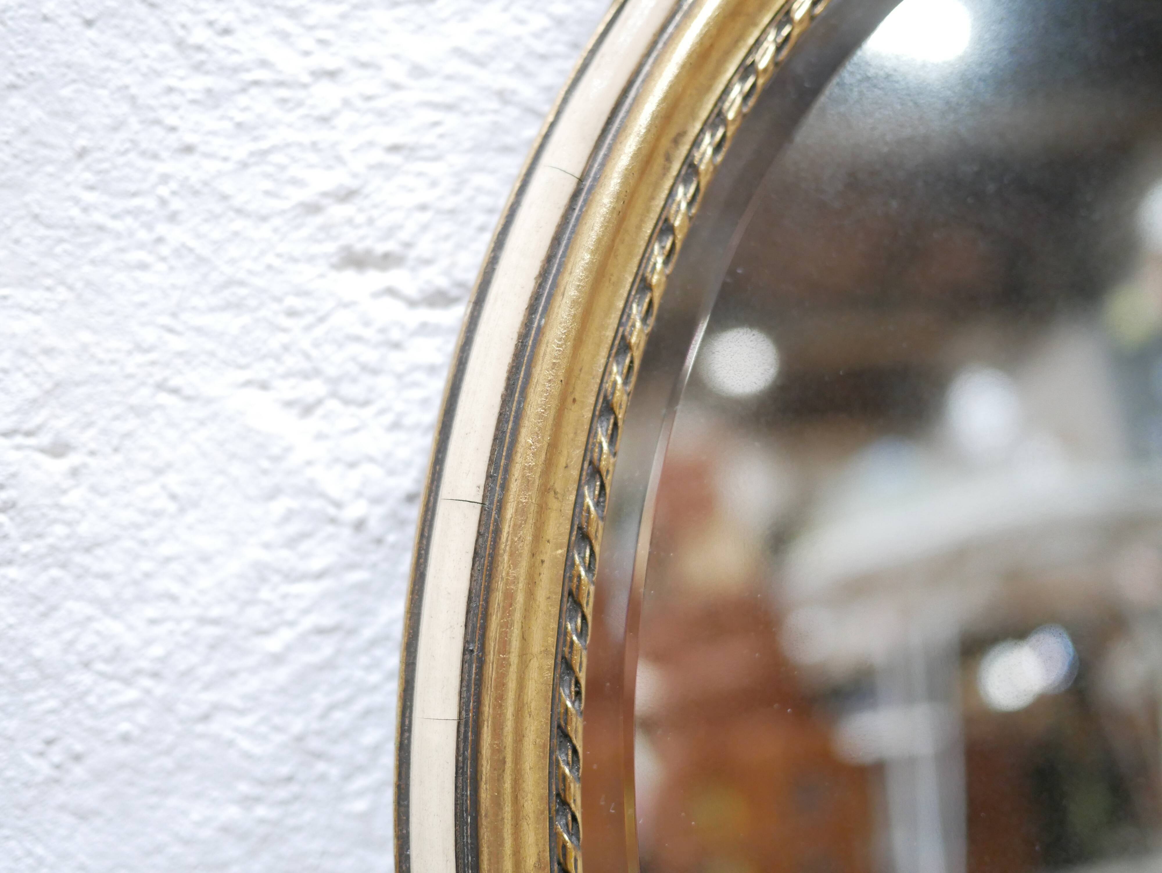 Old oval mirror Louis XVI style in gilded wood 50cm x 34cm